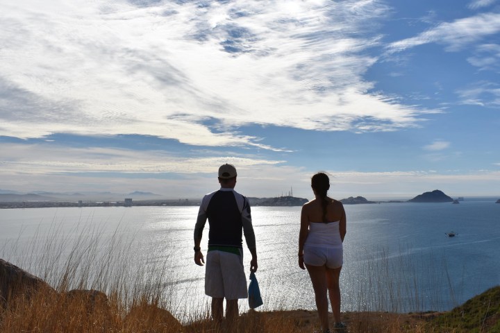 people admiring the coast